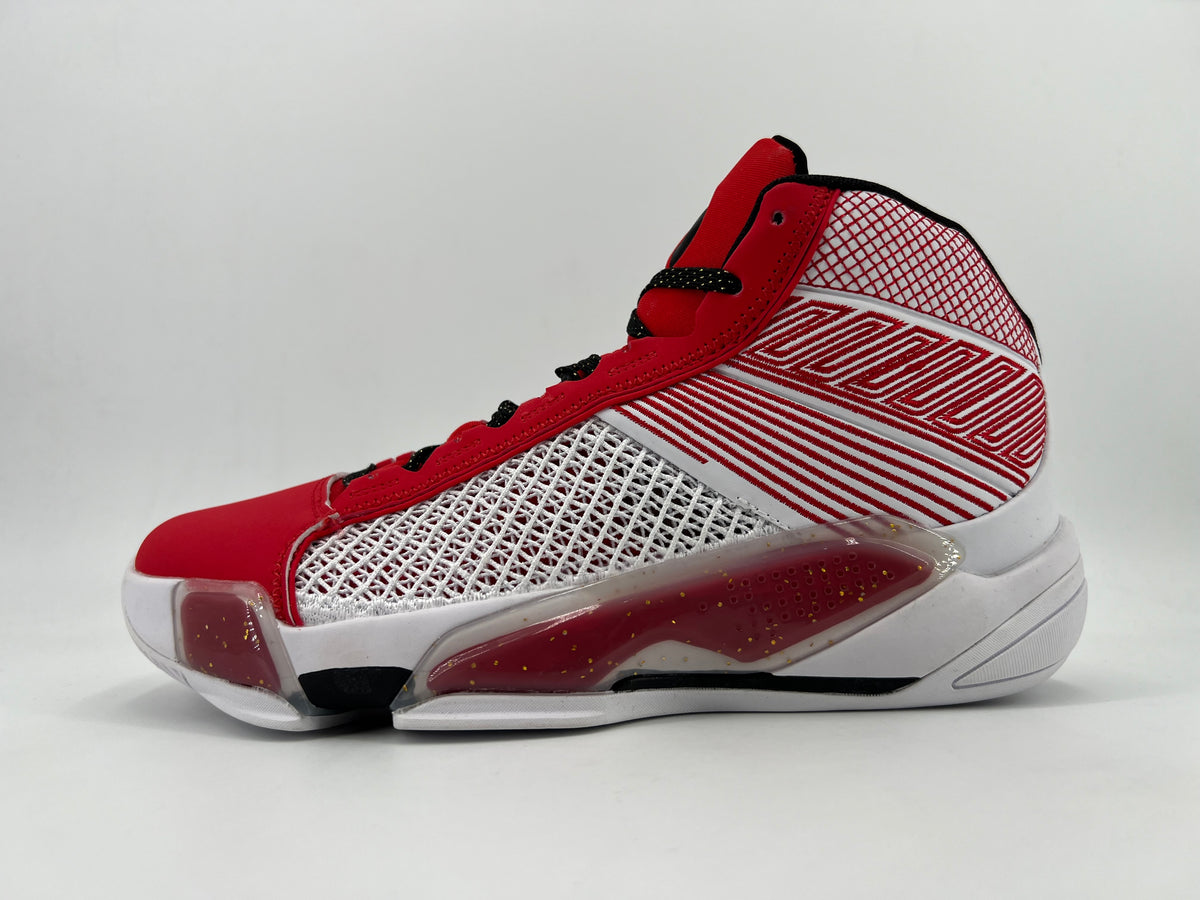 White and red high-top basketball sneaker with patterned side panels, black laces, and a sculpted sole