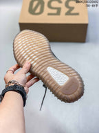 Close view of the translucent ribbed outsole with a visible Yeezy Boost insert.