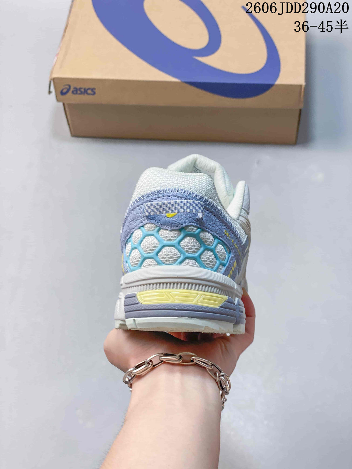 Rear view of the sneaker showing the padded heel, blue mesh detailing and layered sole.