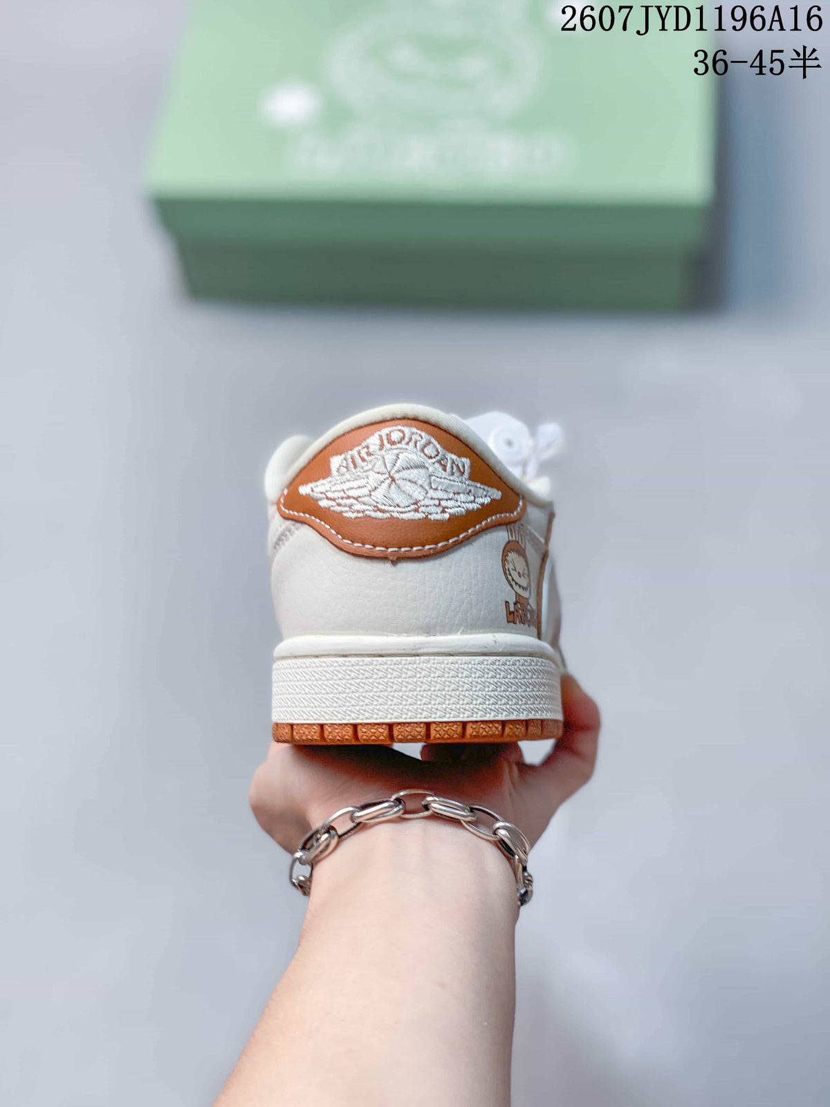 Rear view of the sneaker showing the Jordan wing logo on a brown heel panel.