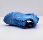 Top-side view of a blue Alo sneaker showing the textured upper, laces and padded collar.