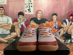 Front view of mauve and burgundy Nike Kobe basketball shoes with gum-colored outsoles