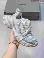 White Balenciaga 3XL-style sneaker with iridescent silver accents