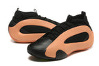 Pair of black and peach-orange Harden Vol. 8 basketball shoes