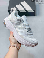 White Adidas Terrex low-top shoe with gray accents and a sculpted sole; image also displays the size range 36–45.