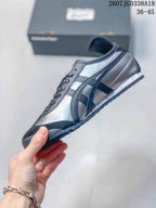Side profile highlighting the contrasting stripes, low-top shape, and lace-up construction.