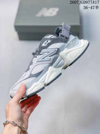 Side view highlighting the layered upper, mesh panels, chunky sole, and heel strap.