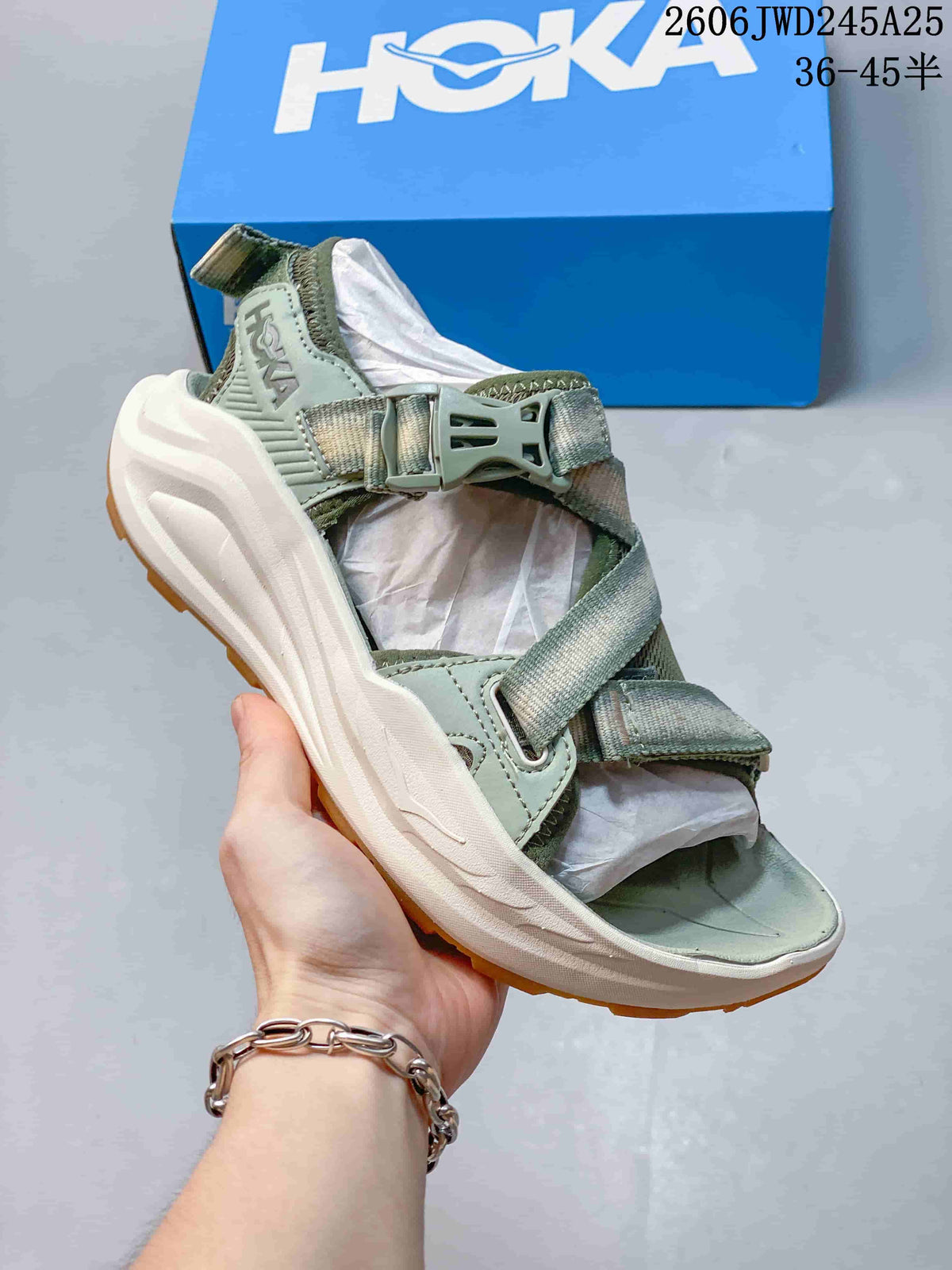 Sage green HOKA Infini Hike TC sandal with cream-colored sole
