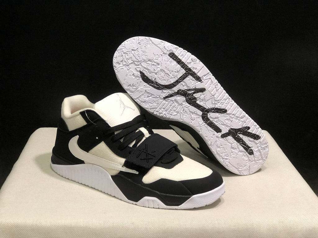 Sneaker angled to show the textured white outsole and black outsole graphics.