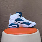 Side view of a white and blue Jordan 6-style high-top sneaker