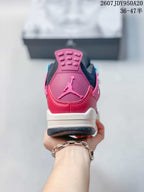 Rear view showing the pink heel panel, raised Jumpman logo, black collar, and white midsole.