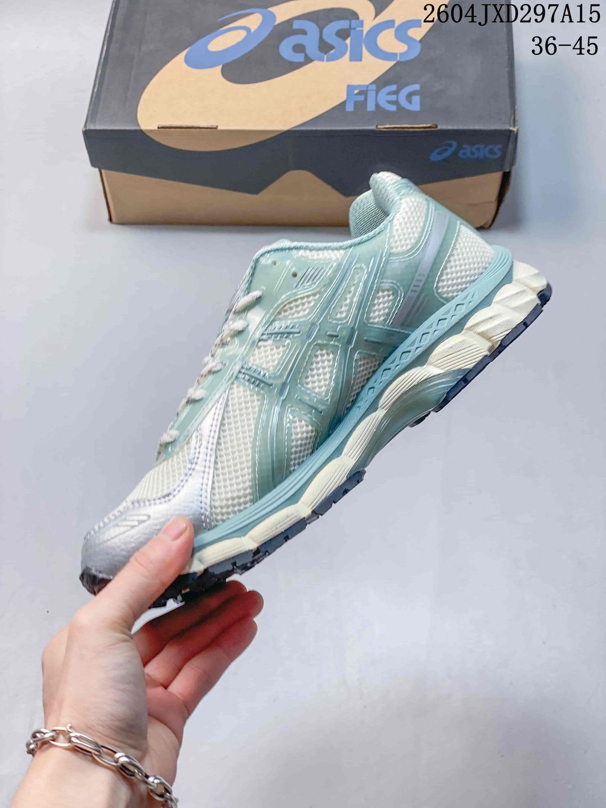 Side profile of the pale sage and white mesh sneaker with layered overlays