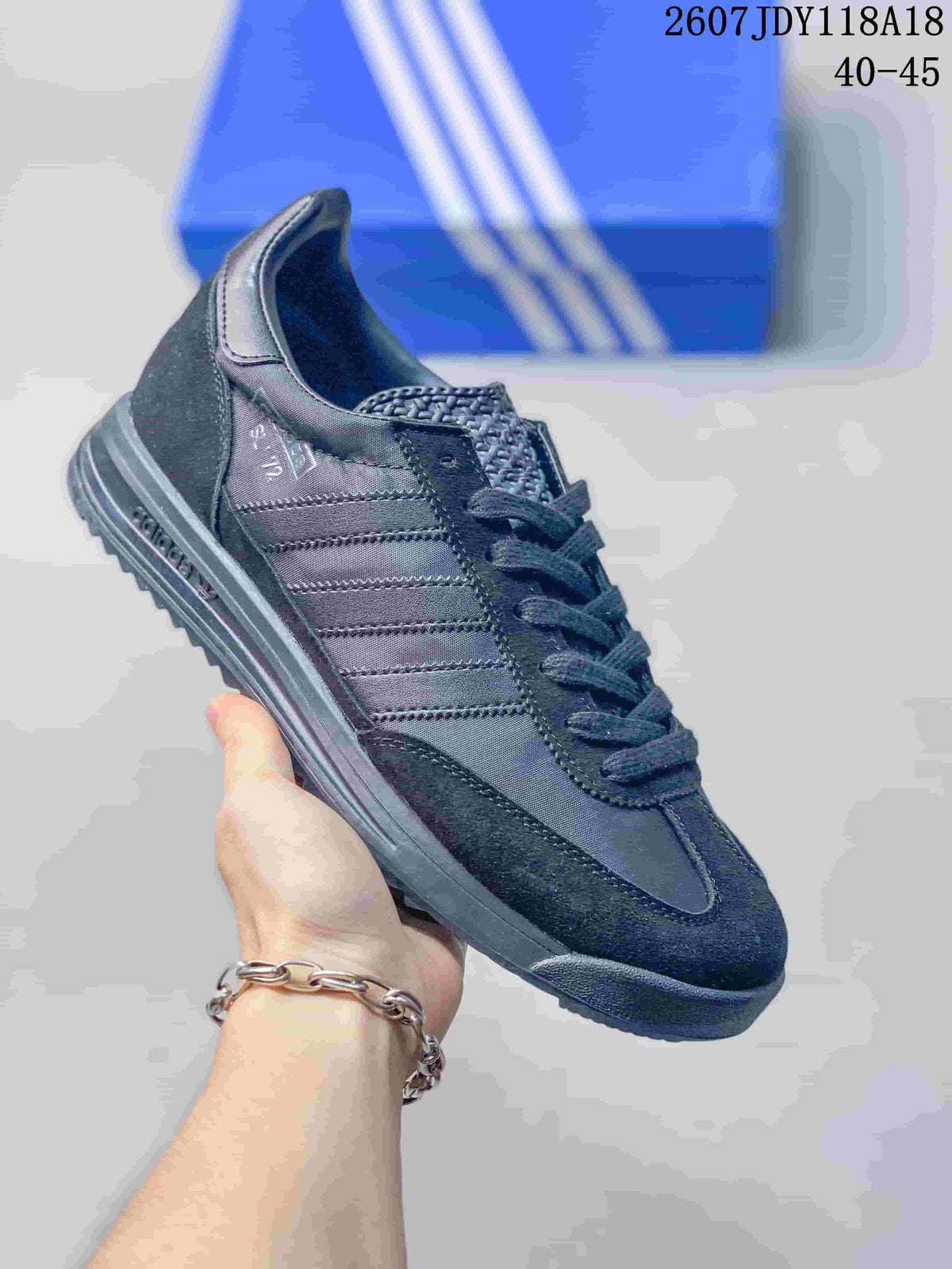All-black adidas SL 72 sneaker with tonal branding and outsole.