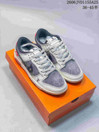 Pair of gray and white low-top sneakers with contrasting perforated toe panels