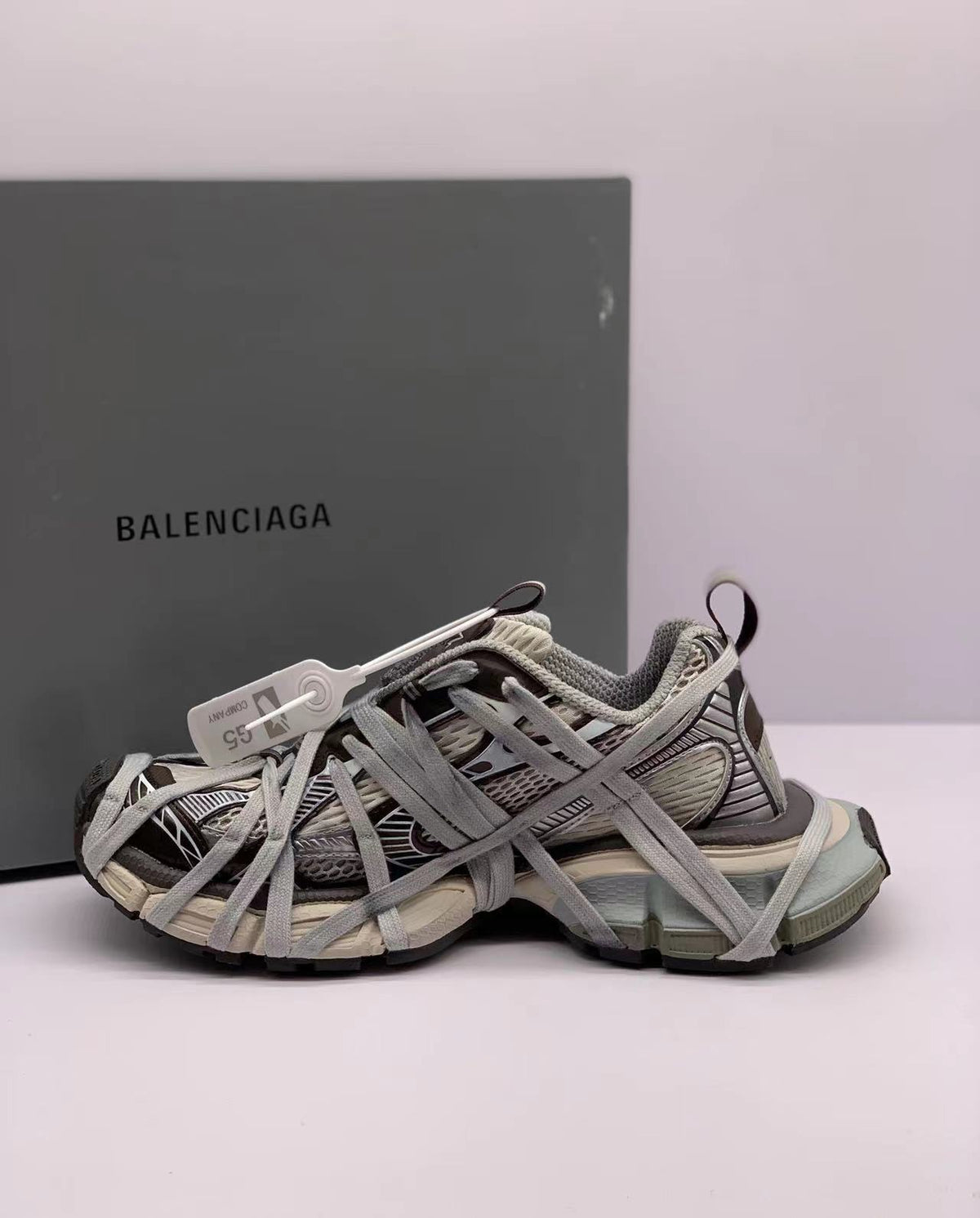 Opposite side view showing the layered laces, mesh-style panels, and contrasting sneaker overlays.