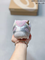 Rear view showing the silver and pink heel details and outsole of an ASICS Hypersync sneaker.