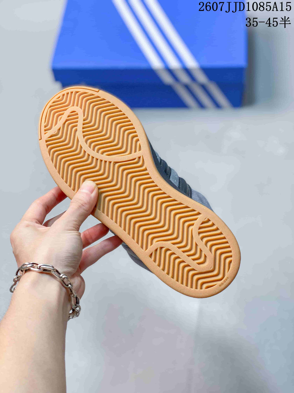 Close view of the gum-colored outsole with a patterned tread.