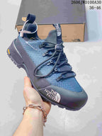 Blue and dark gray low-top The North Face Glenclyffe shoe with cord-style laces.