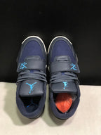 Top-down view showing the navy mesh toe areas, laces, broad forefoot straps, and blue branding.