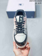 Top view of the sneaker showing black laces, a perforated light-colored toe, and MLB tongue branding.