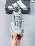 Top view of the shoe showing the tongue and cord-style laces