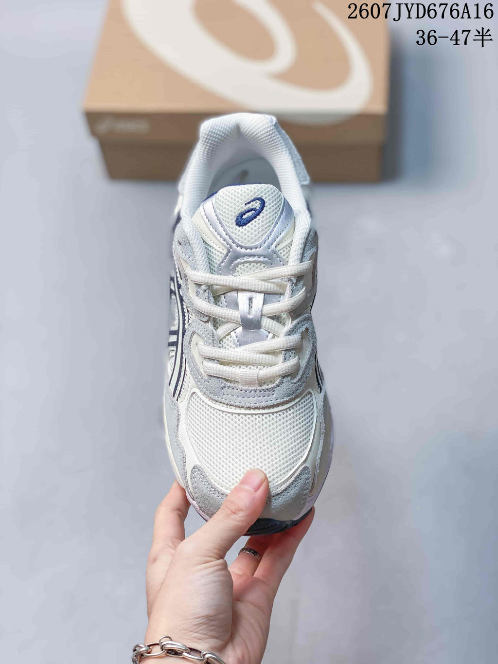 Top view of the sneaker showing the mesh toe box, padded tongue, laces and ASICS branding.