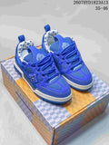 Pair of blue Louis Vuitton Trainer sneakers displayed on a patterned box, showing the front and side details.