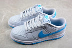 Pair of low-top sneakers displayed from an angled side view, showing gray and white uppers with bright blue Swooshes and outsole accents.