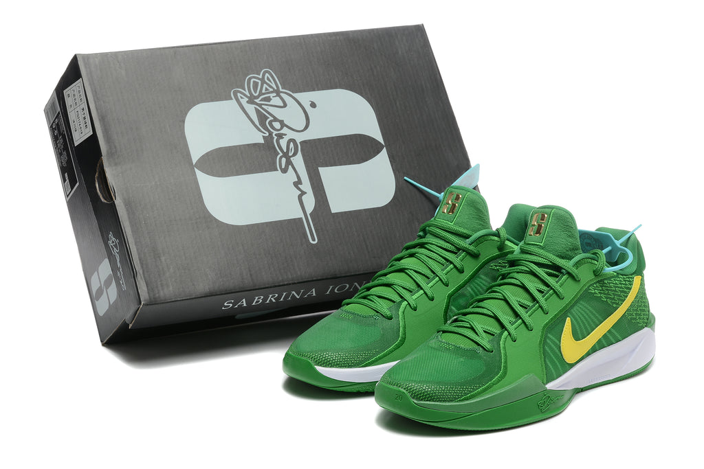 Green Nike Sabrina 2 basketball shoes beside a black Sabrina 2 shoe box.