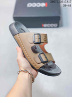 Angled view of the brown and black ECCO sandal highlighting the two adjustable buckles and dark outsole.