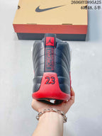 Rear view of a black and red Jordan Air Jordan 12 sneaker showing the heel details