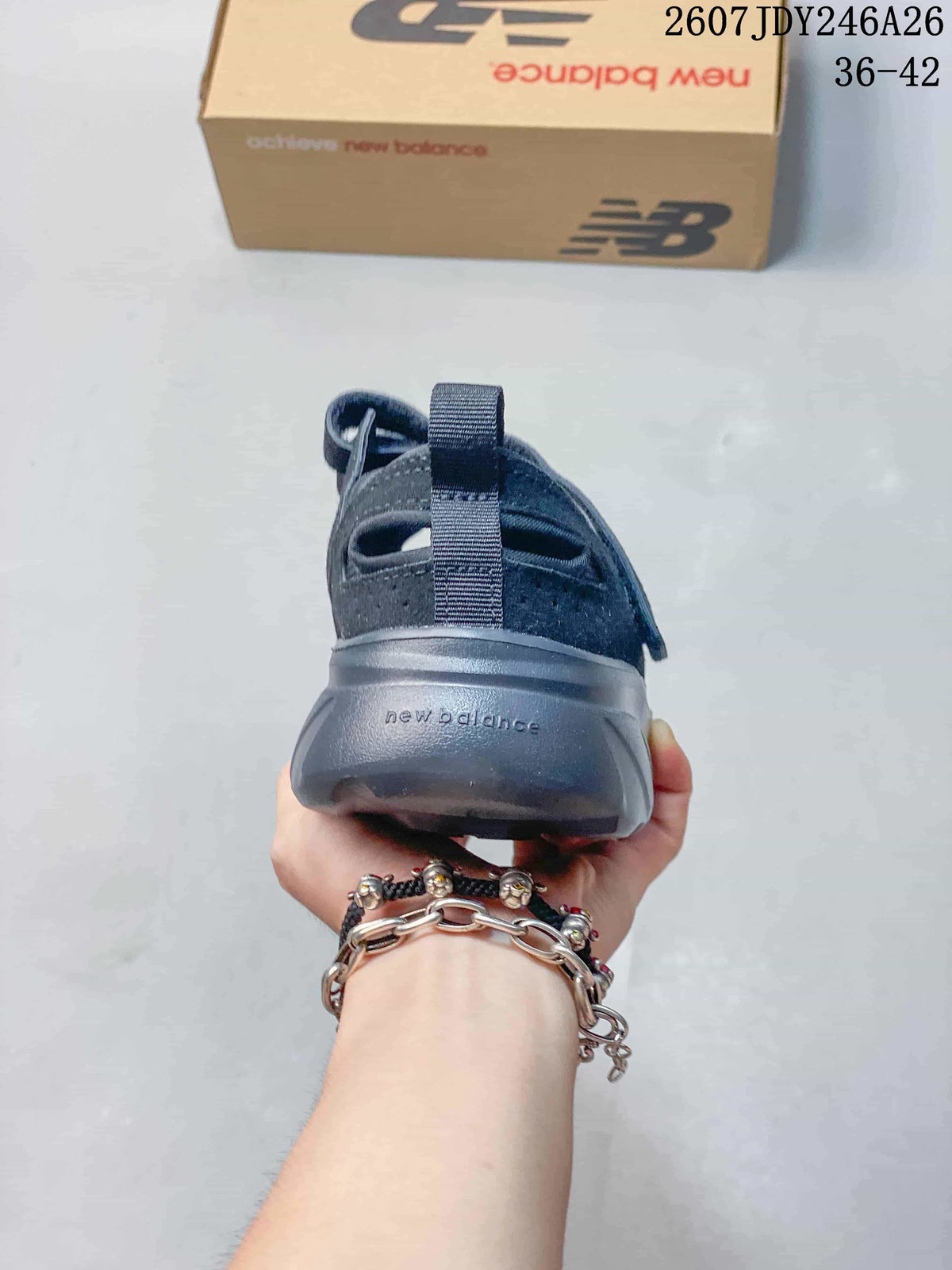 Rear view showing the heel pull tab, molded outsole, and New Balance branding.