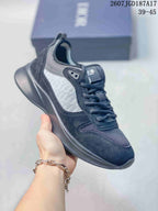 Black and gray Dior B25 Runner sneaker with a dark sculpted outsole and textured side panel.