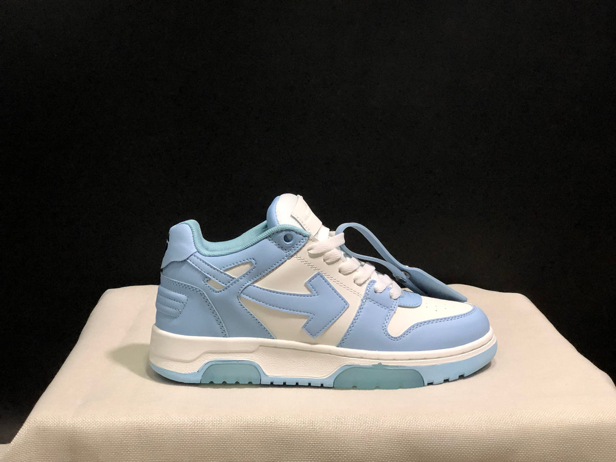 Single sneaker side view showing the light blue and white color blocking and low-top construction.
