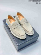 Pair of light beige ECCO slip-on loafers displayed on an ECCO shoe box; visible overlay shows style code 2607GDD607A27 and size range 39–44.