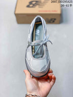 Top view showing the rounded toe, gray laces, and layered upper construction.