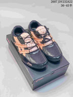 Pair of black ASICS Hypersync sneakers with peach accents, padded tongues, dark laces, and mesh-style toe panels.
