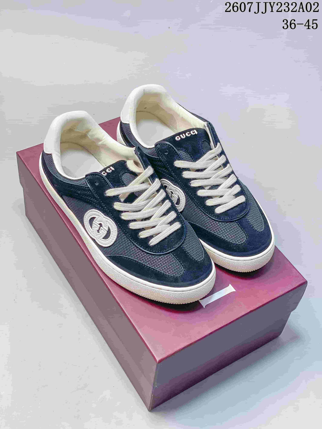 Navy and white Gucci G75 low-top sneakers shown from above