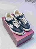 Navy and white Gucci G75 low-top sneakers shown from above