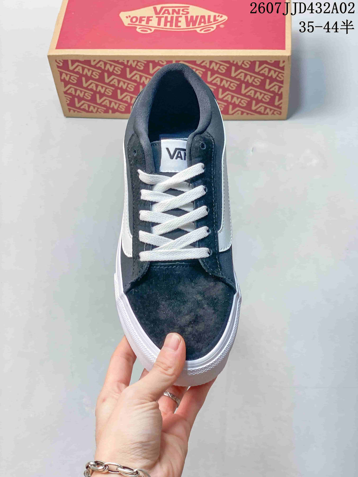 Top view of a navy lace-up sneaker with white laces and side stripe
