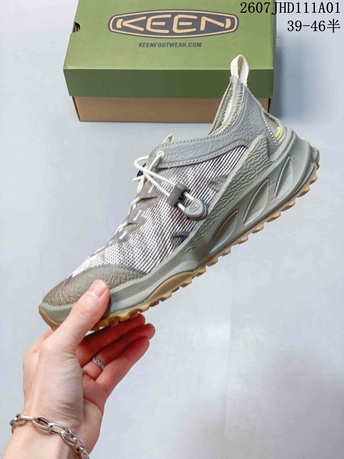 Side view of a KEEN Zionic ADV low hiking shoe, showing the mesh-look upper, overlays, quick-lace closure, and lugged outsole.