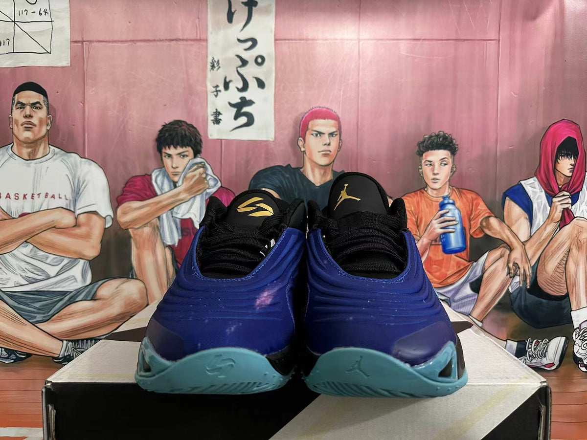 Front view of black and blue Jordan basketball shoes with aqua outsoles.