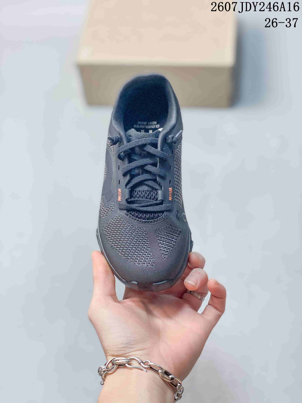 Top view of the dark gray lace-up sneaker showing the textured toe and tongue.