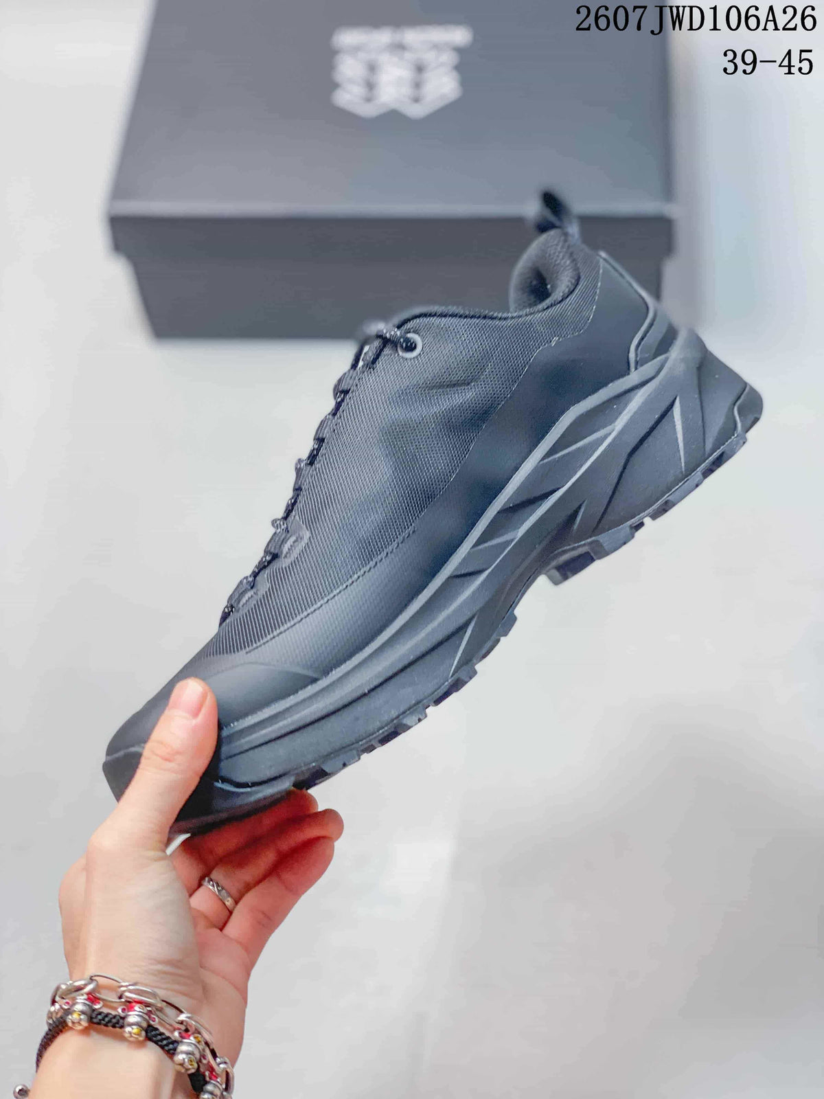 Side profile of the hiking shoe showing the mesh upper, lace system, reinforced toe, and rugged outsole.