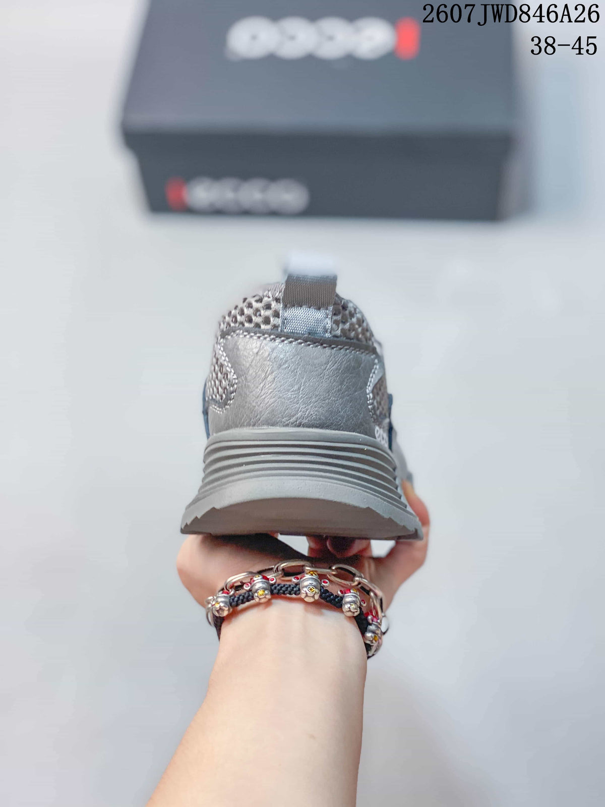 Rear view of the grey sneaker showing the padded heel, pull tab and layered outsole.