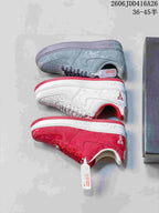 Red, white, and gray patterned low-top sneakers shown from the side