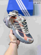 Gray and white adidas Response CL sneaker with coral and dark blue accent panels.