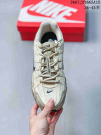 Top view showing the laces, mesh toe box, layered overlays, and navy detailing.