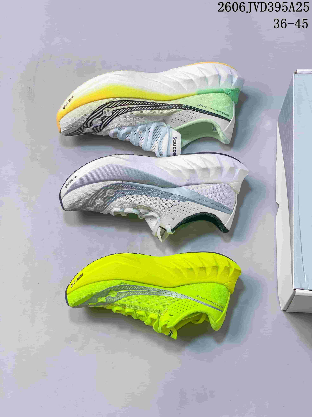 Three Saucony running shoes displayed from above in white, pale blue-gray, and neon yellow colorways; image text states 36–45.