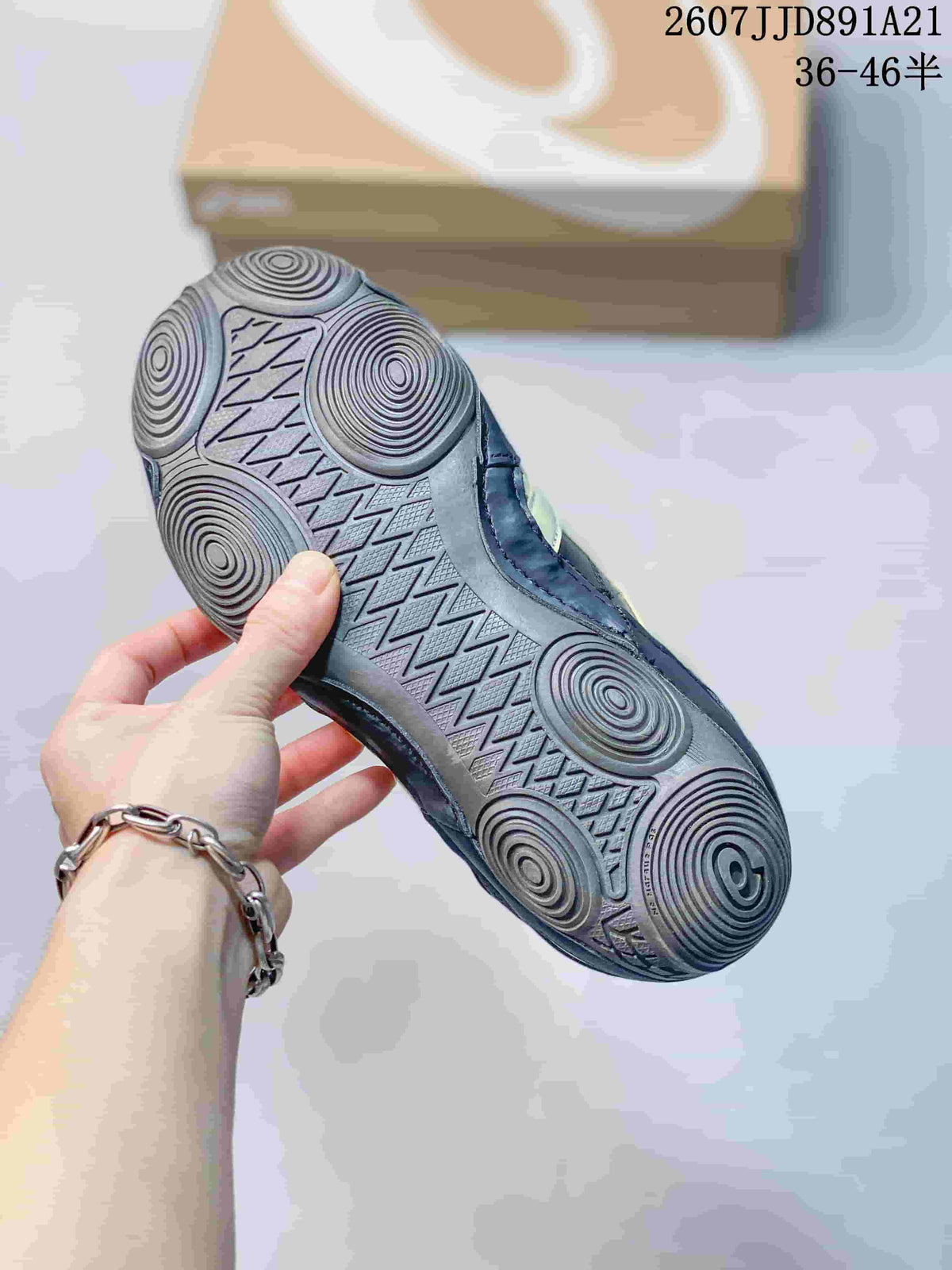 Underside of an ASICS Hypersync sneaker showing the patterned rubber outsole with circular traction details.